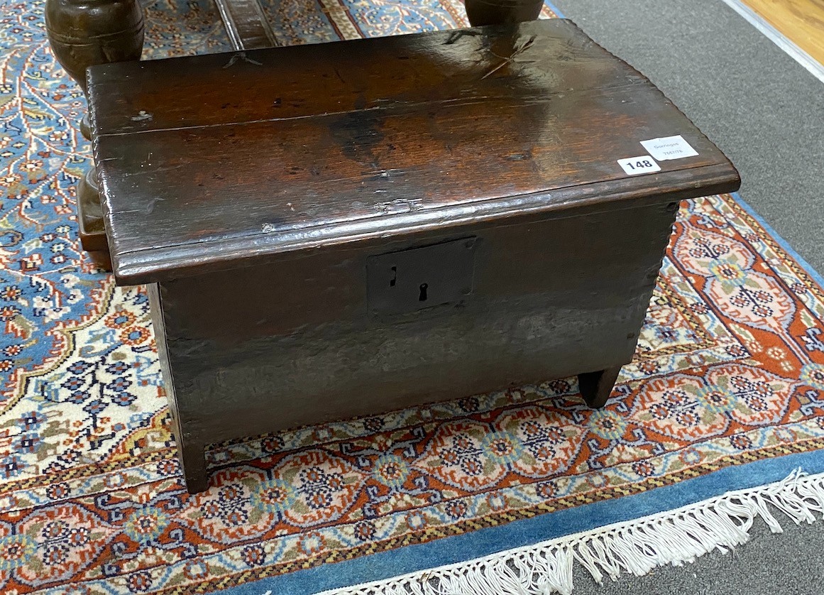 An early 18th century oak six plank coffer, width 53cm, depth 33cm, height 33cm